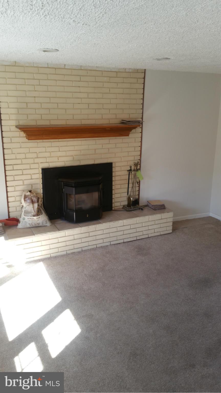 5609 Fisher Road Temple Hills, MD 20748 - Photo 8 of 20 Family room with fireplace