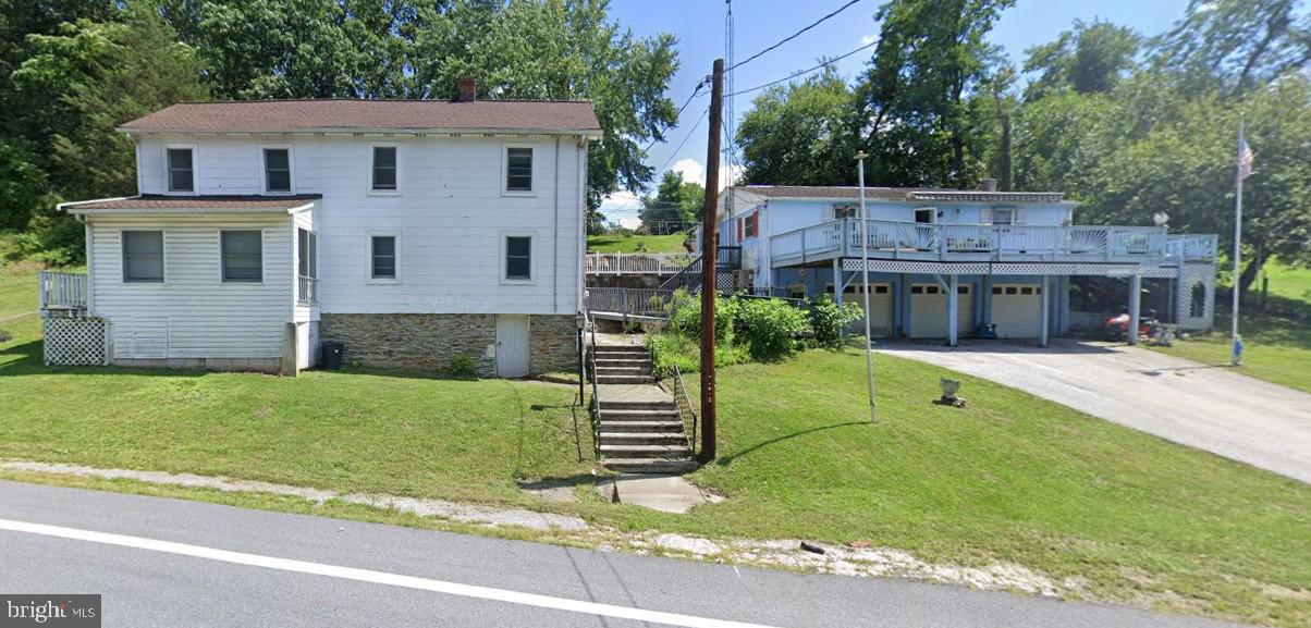 57 Hoff Road Union Bridge, MD 21791 - Photo 1 of 6 a front view of a house with a yard