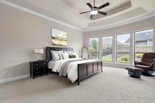 a bed room with a bed and a large window