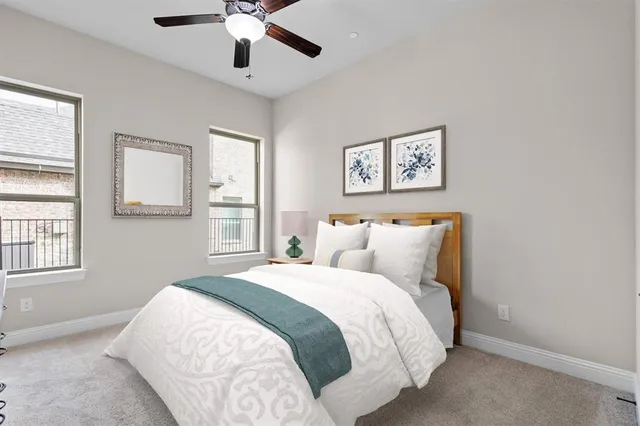 a bedroom with a large bed and a window