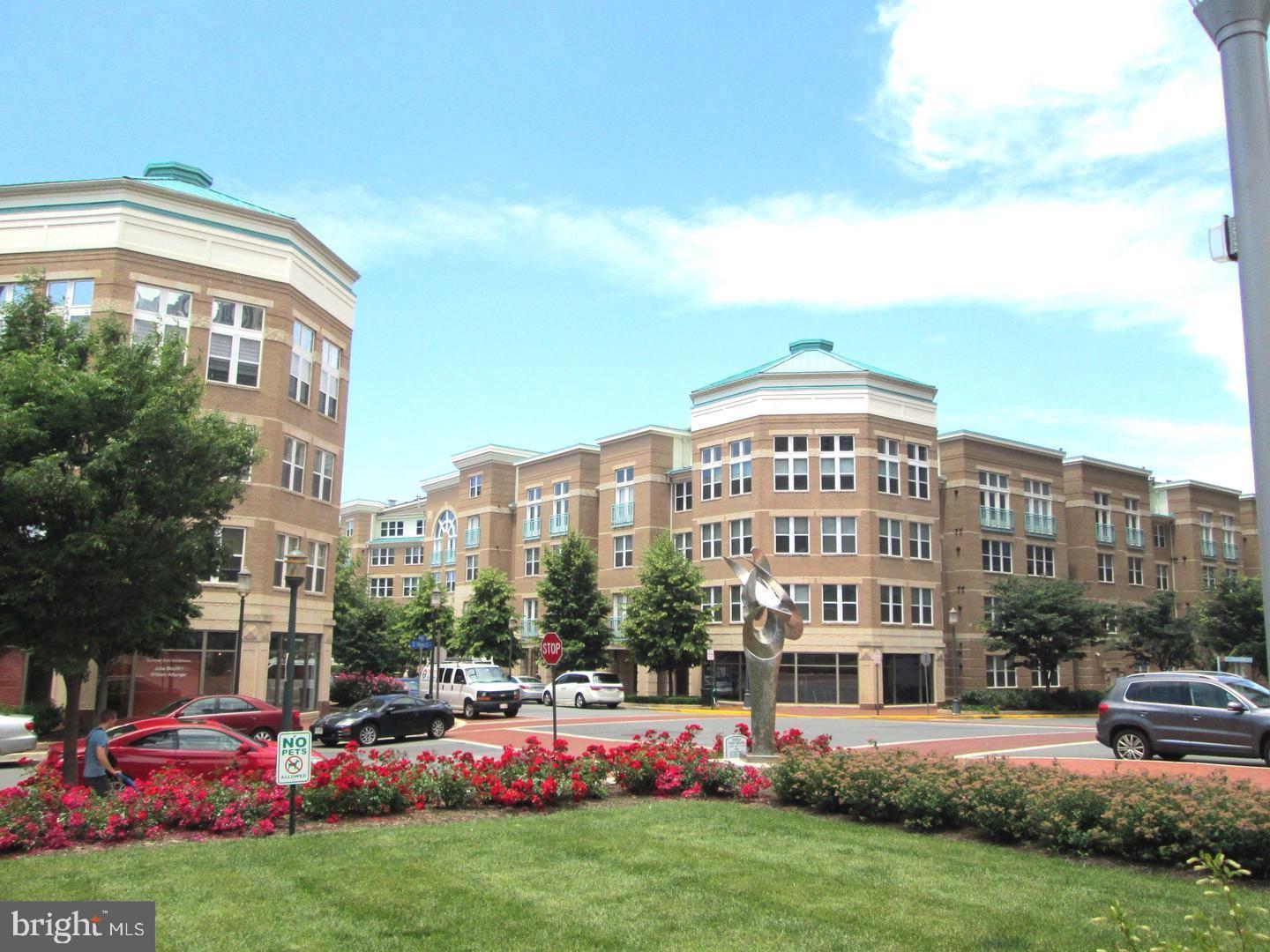 a large building with a yard in front of it