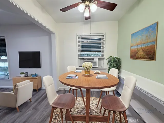 a view of a dining room with furniture window and wooden floor