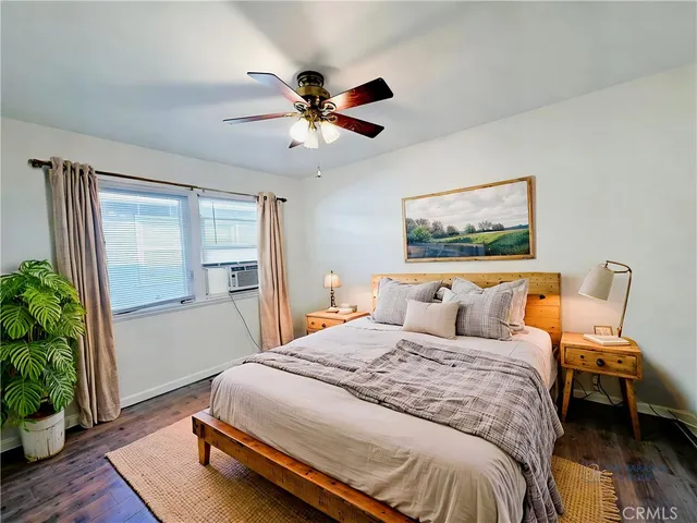 a bedroom with a large bed and a window