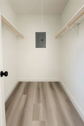 a view of a room with wooden floor