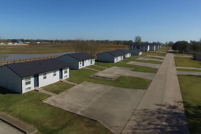 a view of a lake with a table and chairs