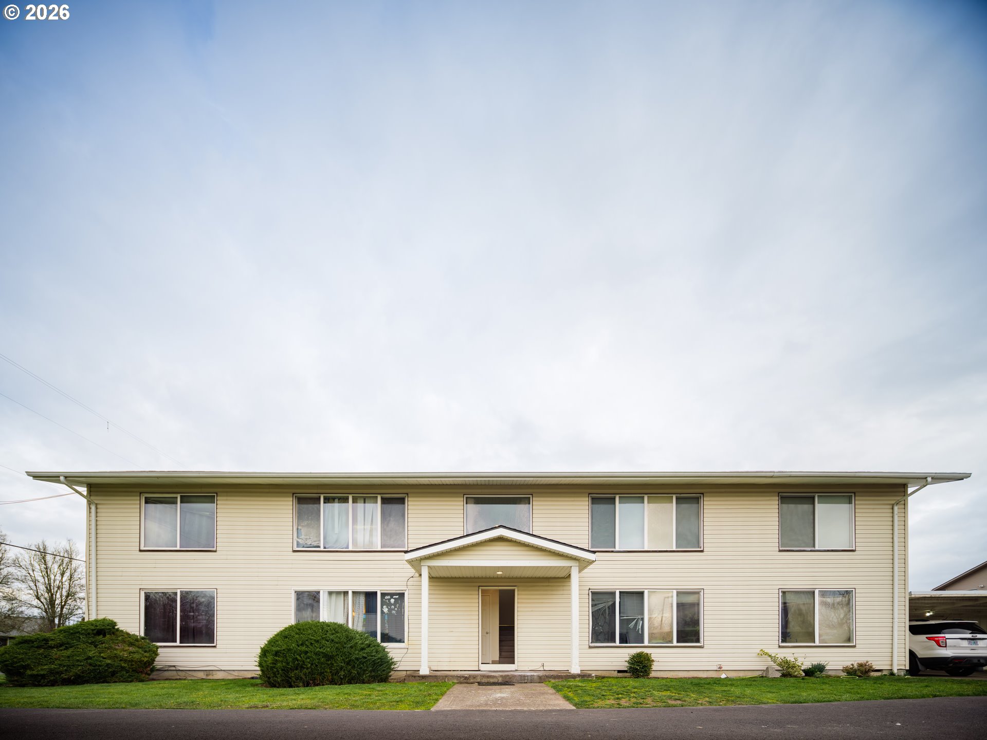 a front view of a house with garden