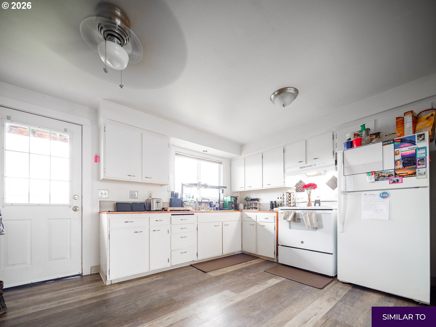 920 18th Avenue Southwest Albany, OR 97321 - Photo 16 of 19 a kitchen with cabinets a sink and white appliances