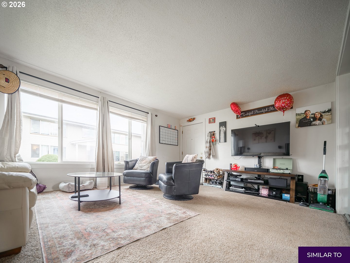 920 18th Avenue Southwest Albany, OR 97321 - Photo 18 of 19 a living room with furniture a flat screen tv and a window