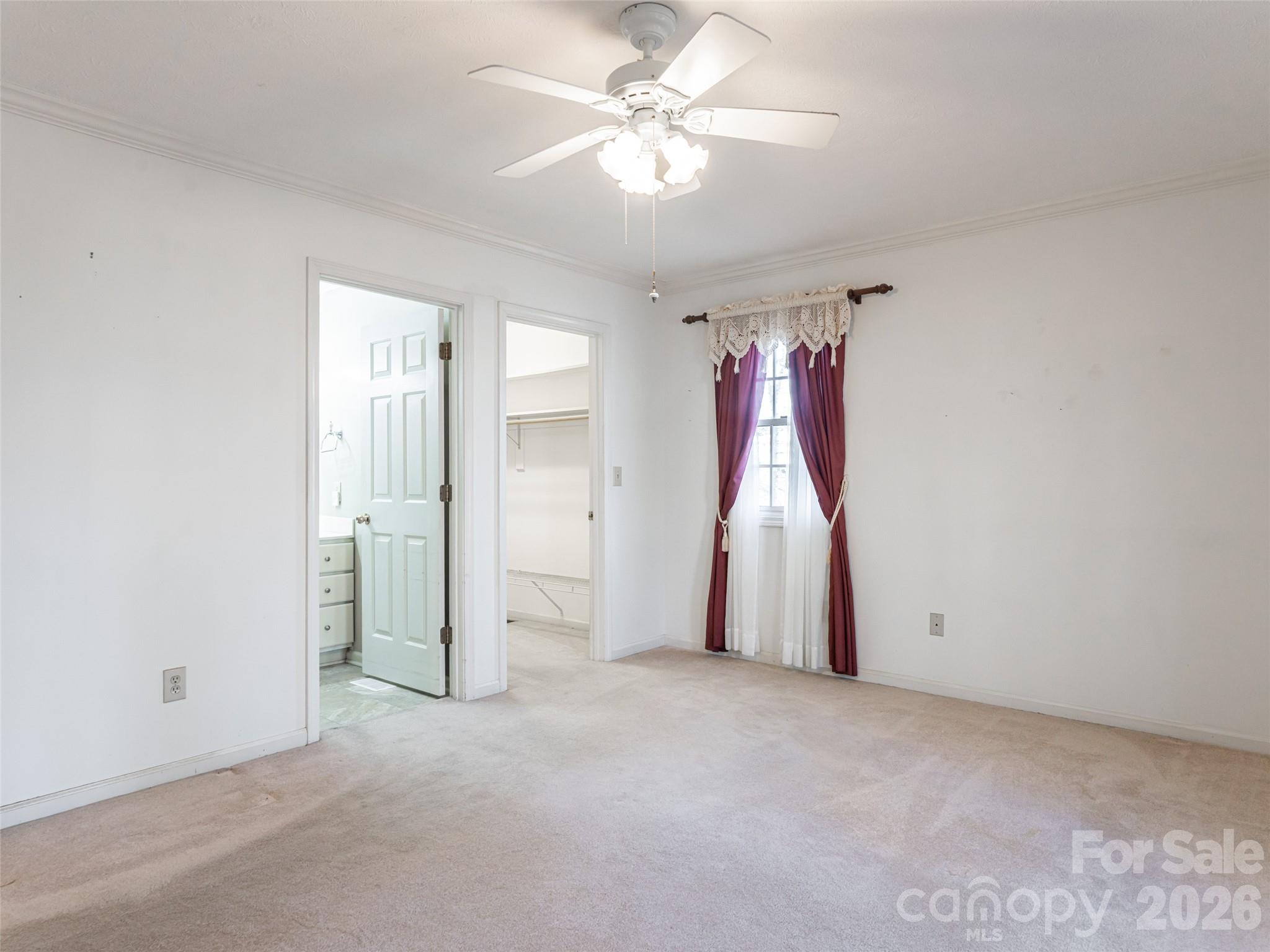 120 Burge Mountain Road Hendersonville, NC 28792 - Photo 23 of 44 an empty room with a ceiling fan and entryway