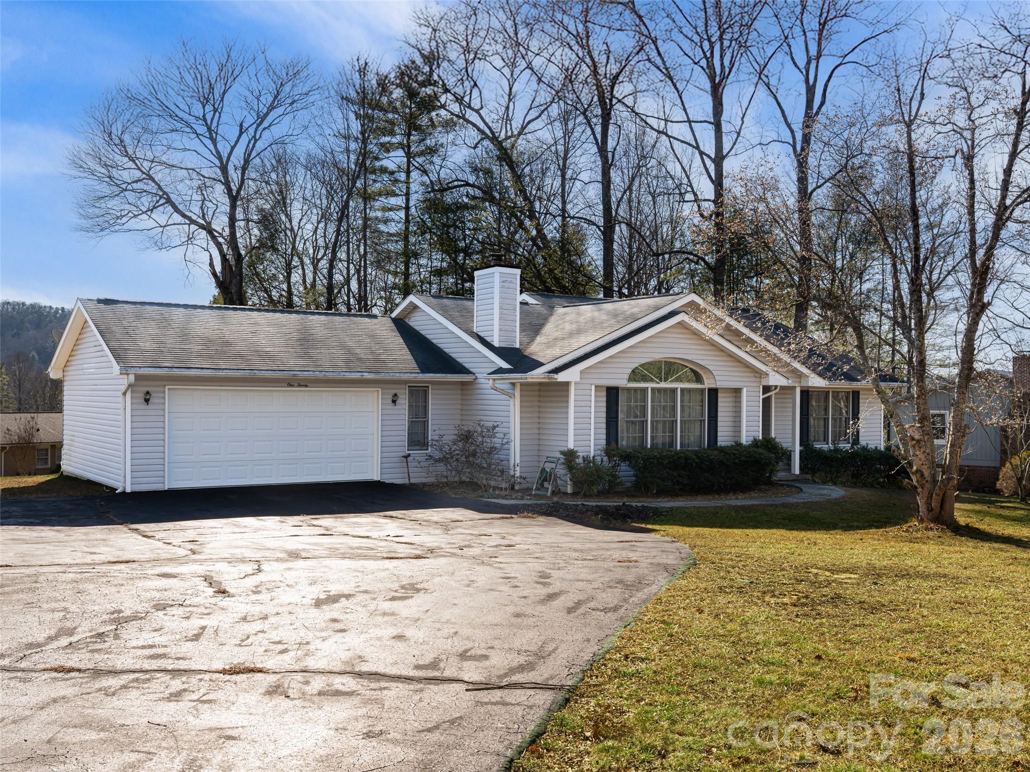 120 Burge Mountain Road Hendersonville, NC 28792 - Photo 3 of 44 a front view of a house with a yard