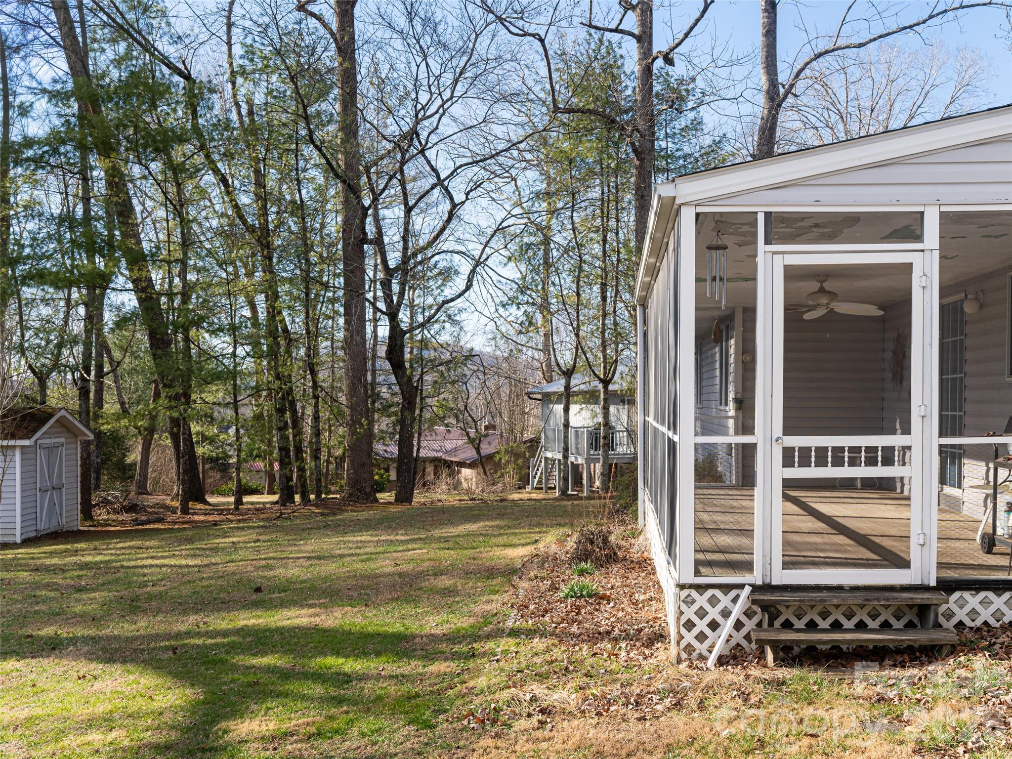 120 Burge Mountain Road Hendersonville, NC 28792 - Photo 36 of 44 a backyard of a house with lots of green space