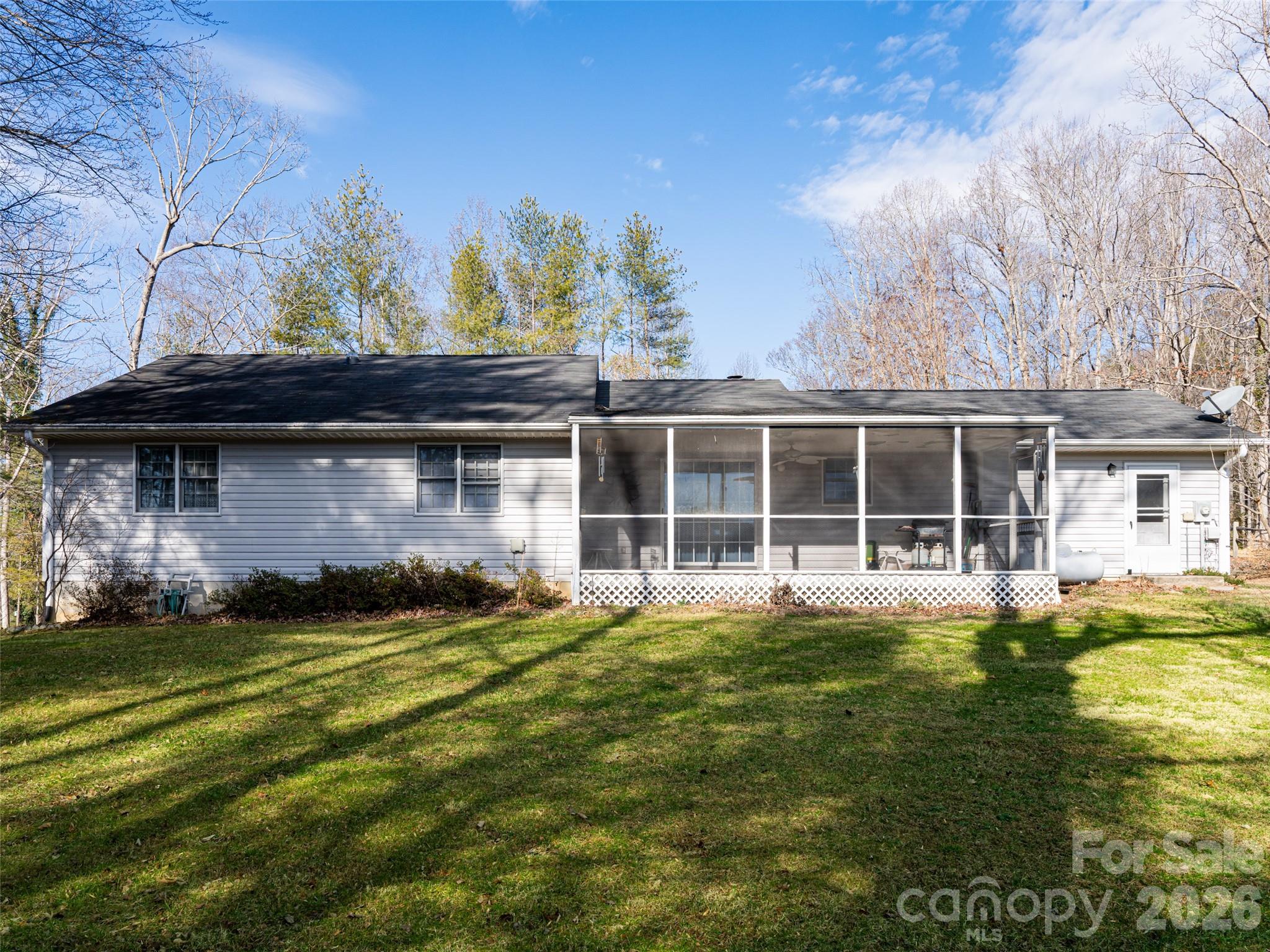 120 Burge Mountain Road Hendersonville, NC 28792 - Photo 40 of 44 a view of a house with a garden
