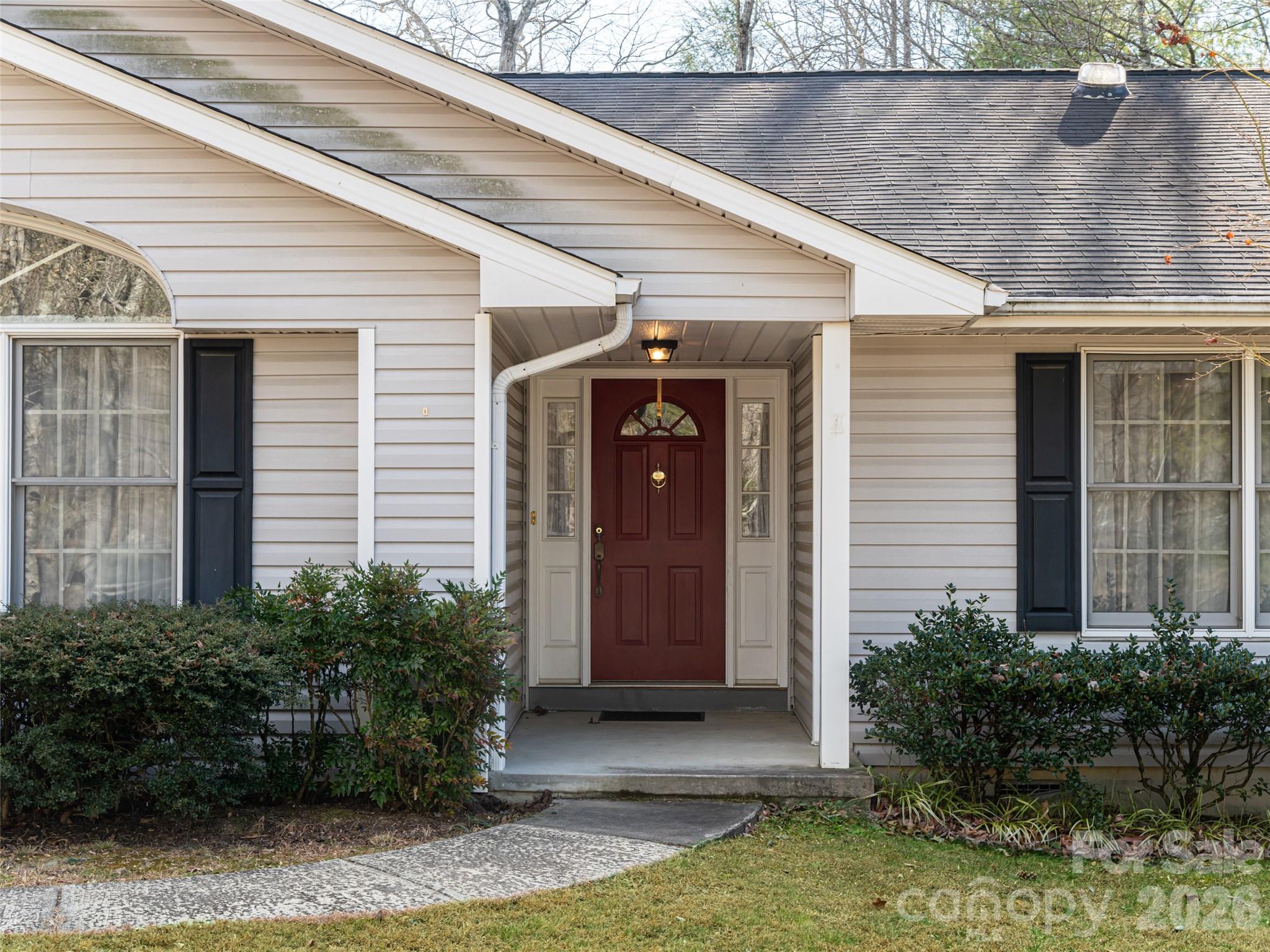 120 Burge Mountain Road Hendersonville, NC 28792 - Photo 4 of 44 a front view of a house with garden