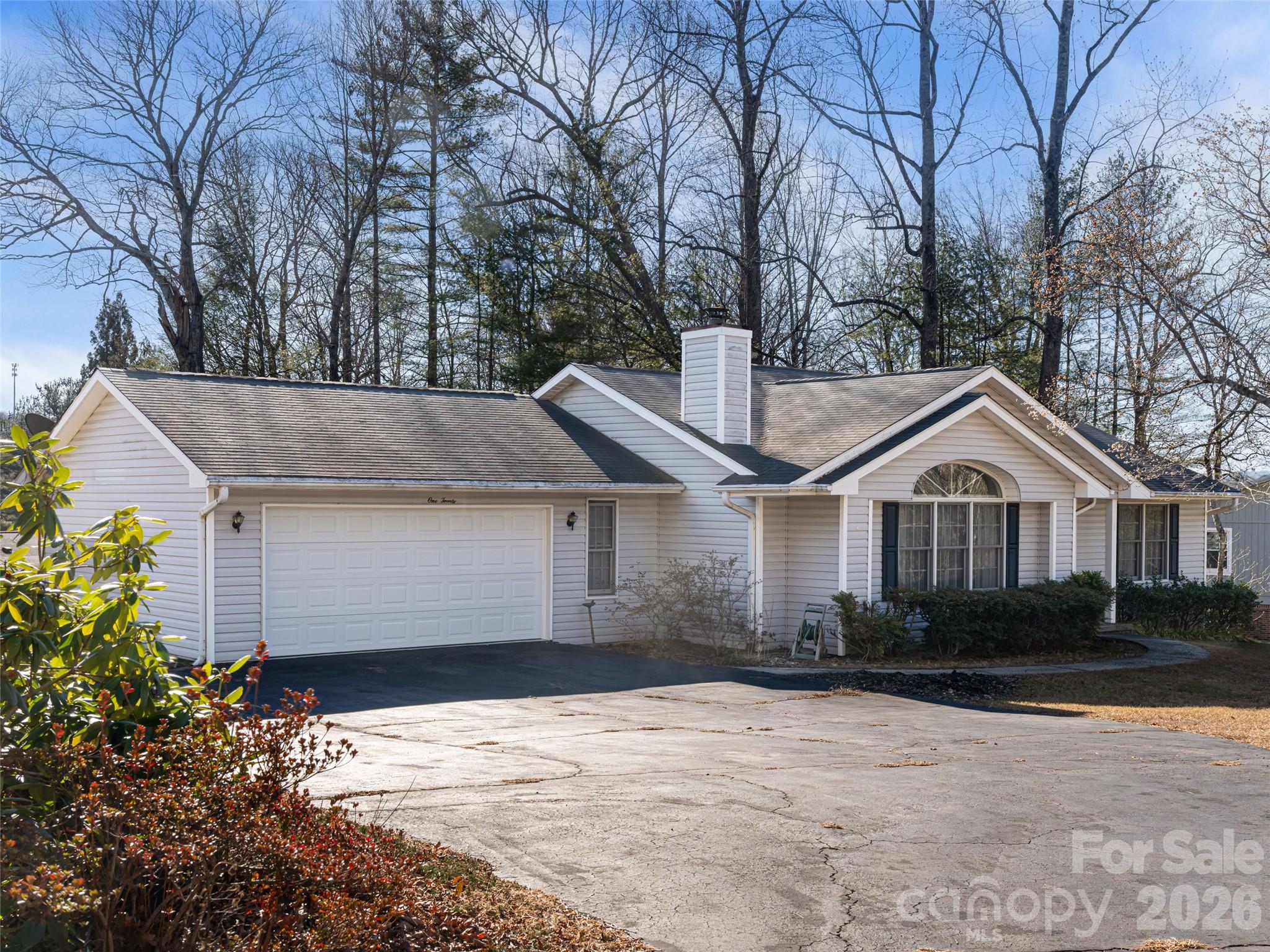 120 Burge Mountain Road Hendersonville, NC 28792 - Photo 43 of 44 a front view of a house with a garden