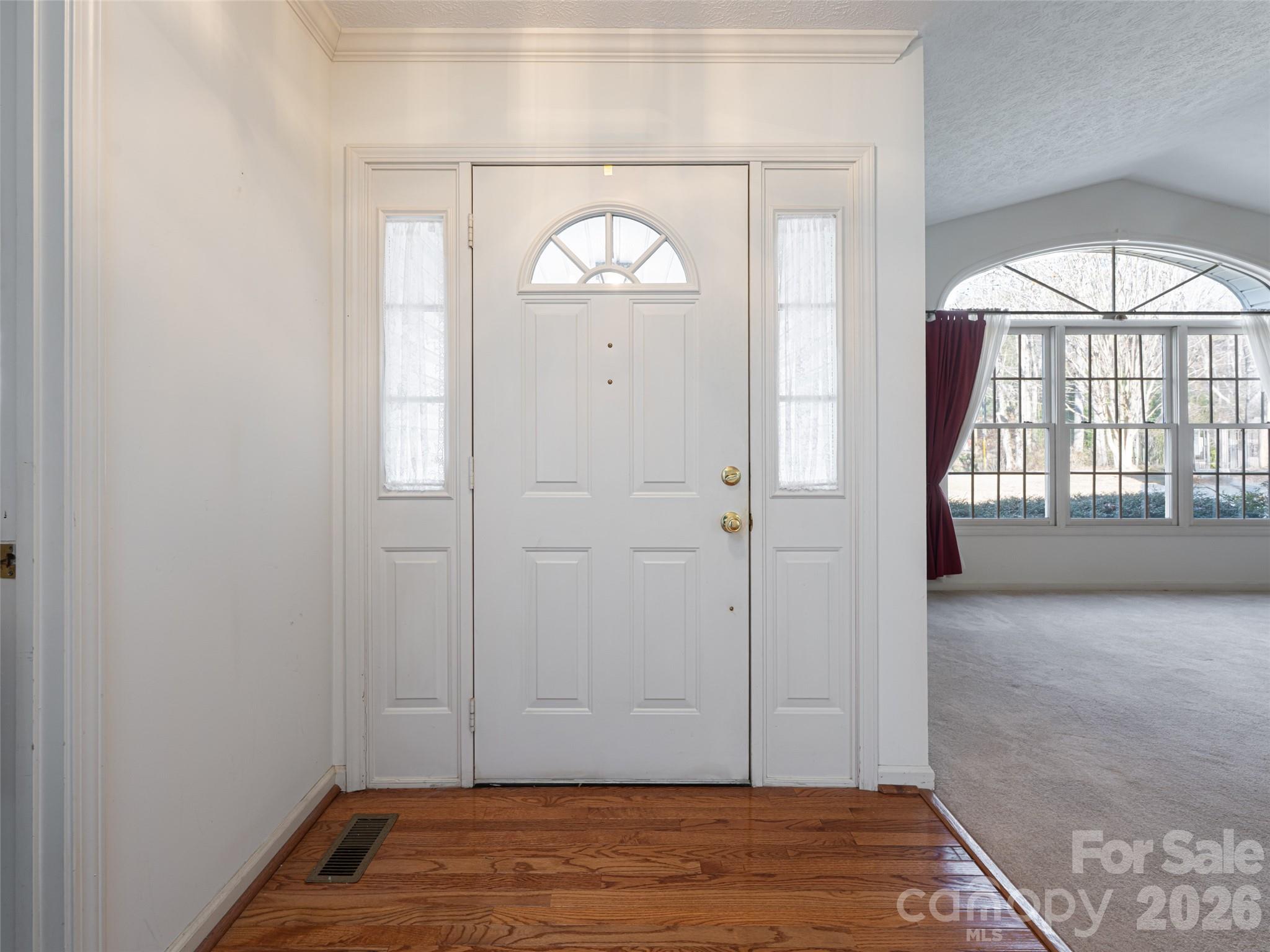 120 Burge Mountain Road Hendersonville, NC 28792 - Photo 5 of 44 an empty room with wooden floor cabinet and a window
