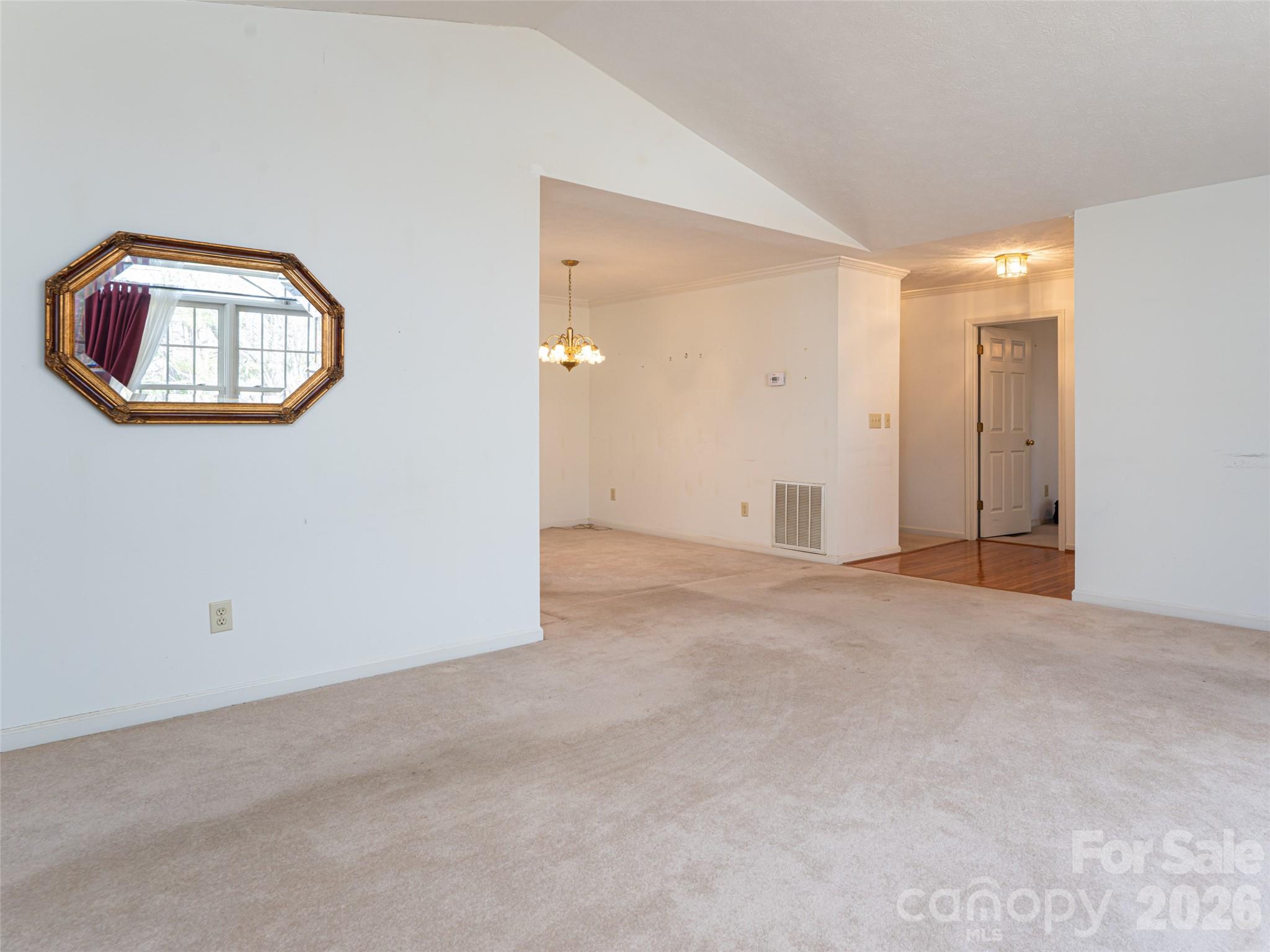 120 Burge Mountain Road Hendersonville, NC 28792 - Photo 10 of 44 an empty room with a entryway and cabinet