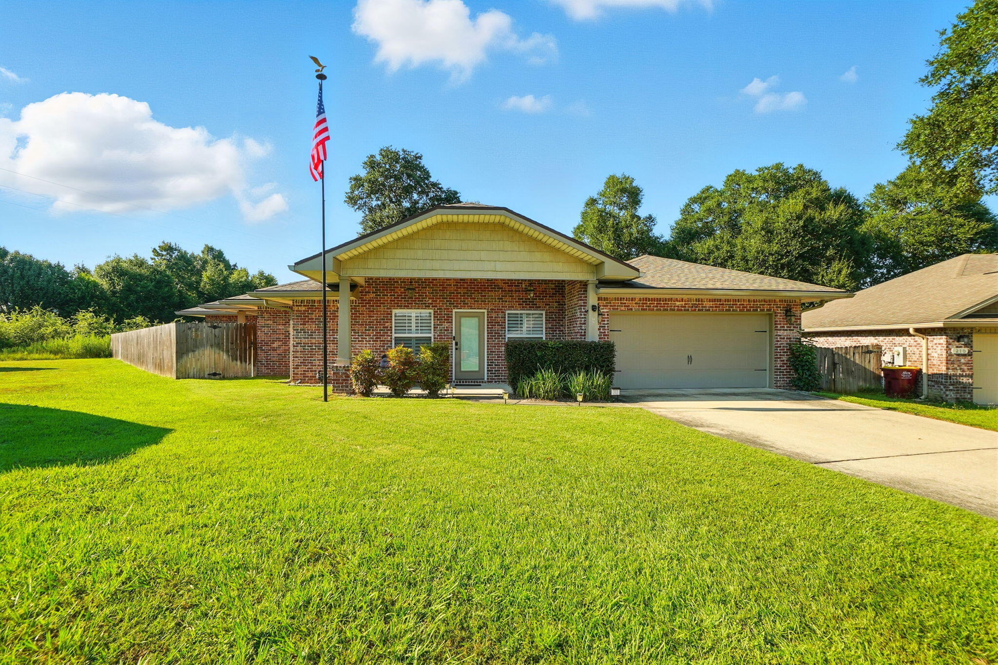 212 Eleases Crossing Crestview, FL 32539 - Photo 1 of 40 a front view of a house with yard and green space