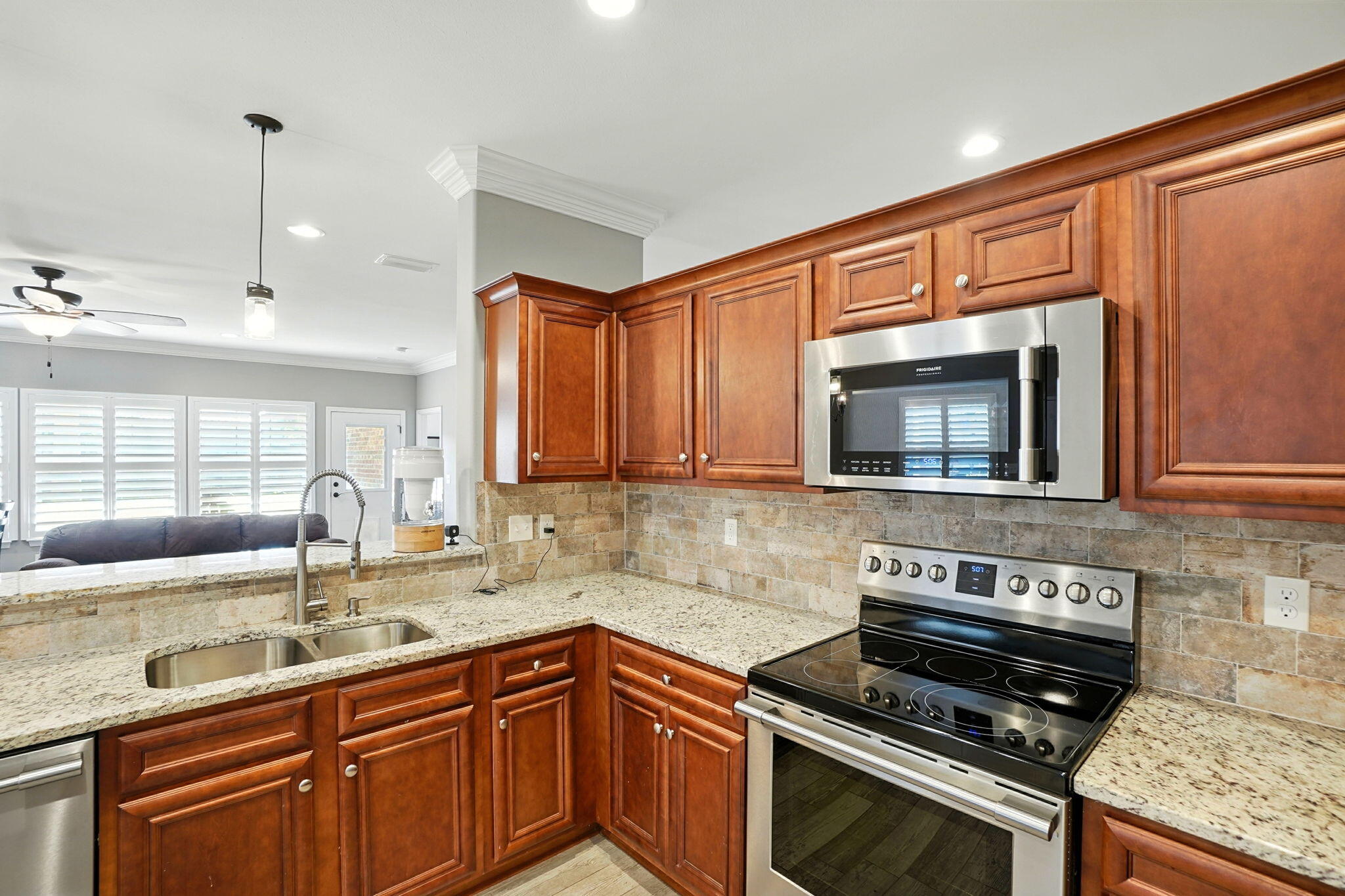 212 Eleases Crossing Crestview, FL 32539 - Photo 11 of 40 a kitchen with a sink stove and microwave