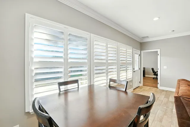 a view of a living room and dining room