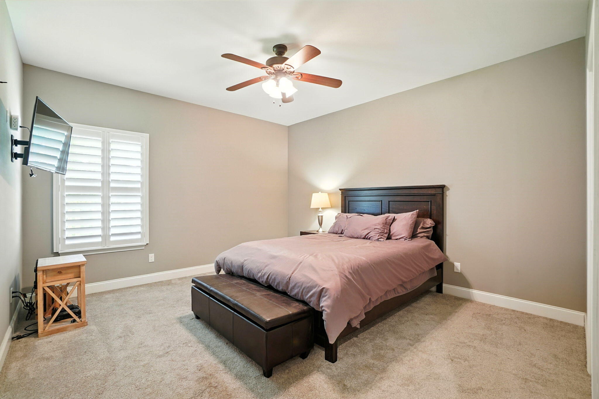 212 Eleases Crossing Crestview, FL 32539 - Photo 22 of 40 a bedroom with a bed and a chandelier