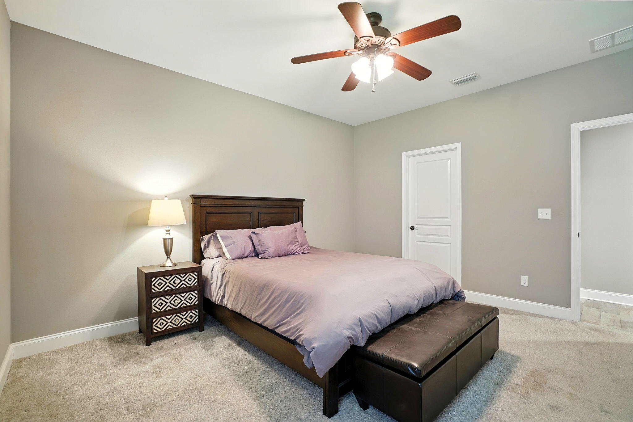 212 Eleases Crossing Crestview, FL 32539 - Photo 23 of 40 a bedroom with a bed lamp and a ceiling fan