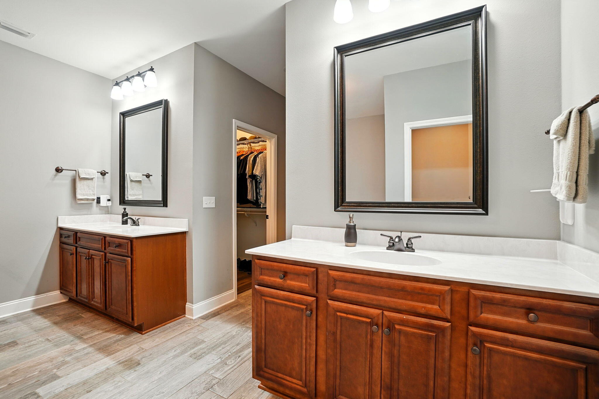 212 Eleases Crossing Crestview, FL 32539 - Photo 28 of 40 a bathroom with a double vanity sink and a mirror