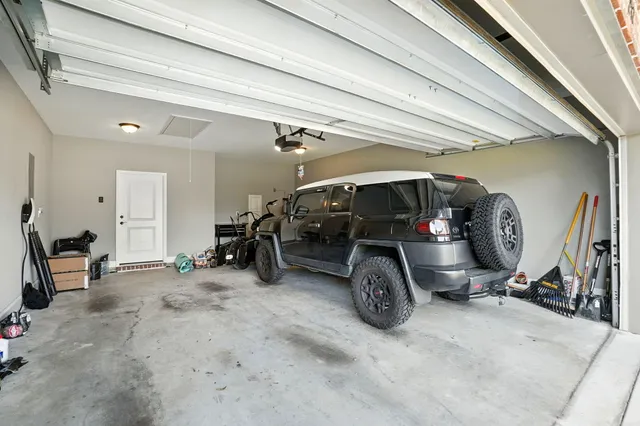 a view of a garage with parked cars