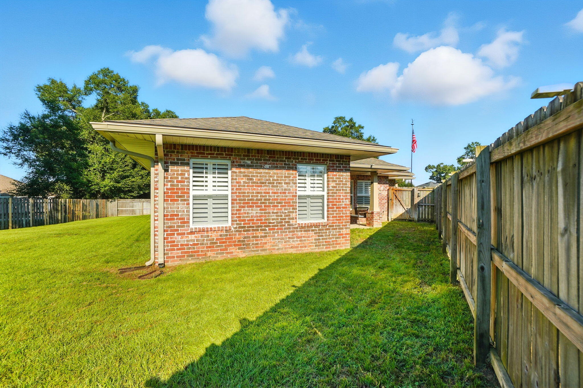 212 Eleases Crossing Crestview, FL 32539 - Photo 36 of 40 a view of a backyard with a garden