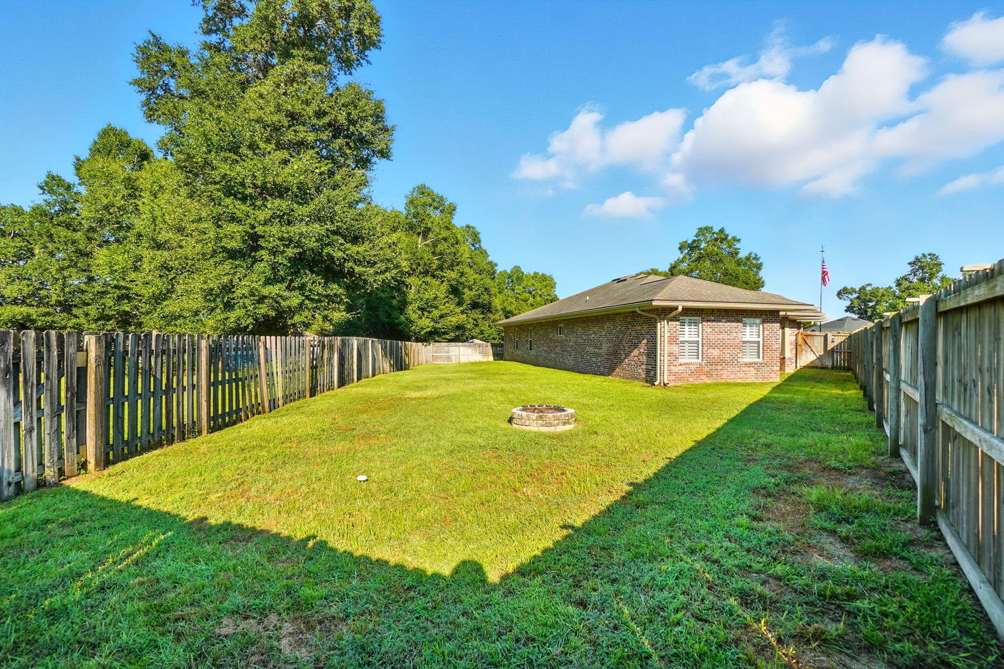 212 Eleases Crossing Crestview, FL 32539 - Photo 37 of 40 a view of a yard with swimming pool and deck