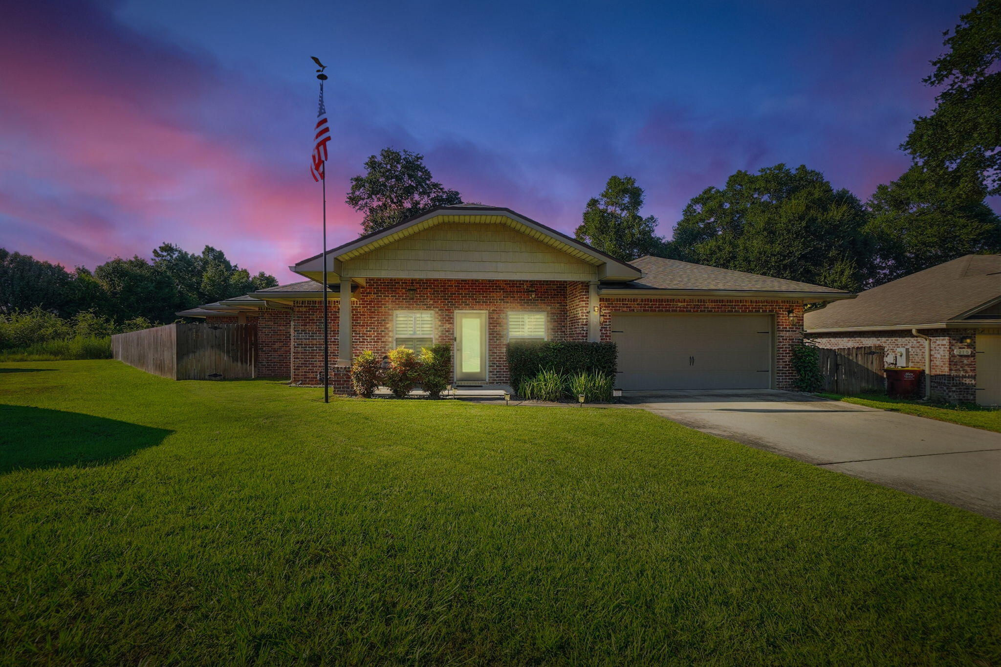 212 Eleases Crossing Crestview, FL 32539 - Photo 7 of 40 a front view of a house with a garden