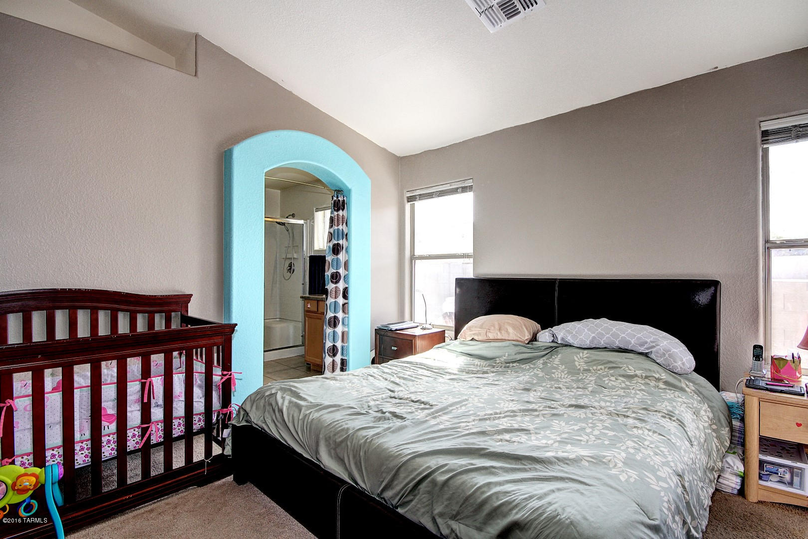 6016 South Avenida Ribero Tucson, AZ 85706 - Photo 8 of 15 a bedroom with a bed and a window
