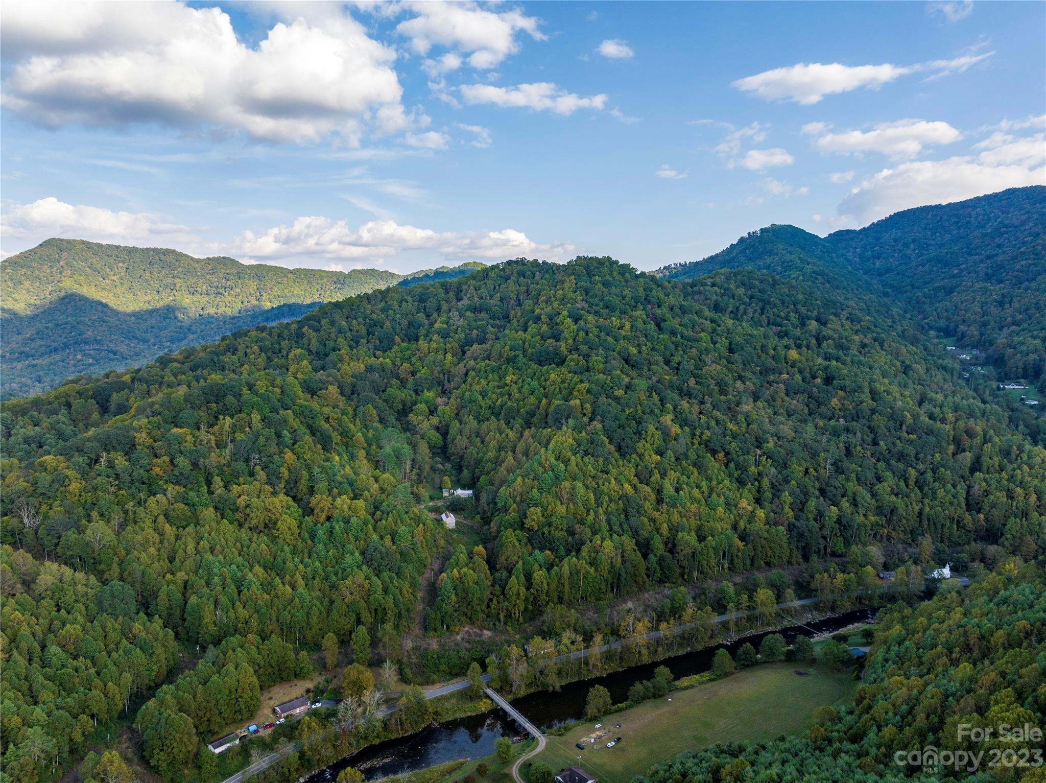 304 Miller Hill Road Burnsville, NC 28714 - Photo 14 of 20 a view of a city with lush green forest