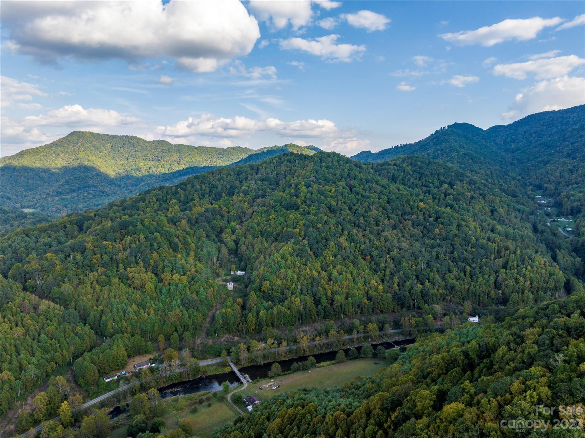 304 Miller Hill Road Burnsville, NC 28714 - Photo 15 of 20 a view of a city with lush green forest