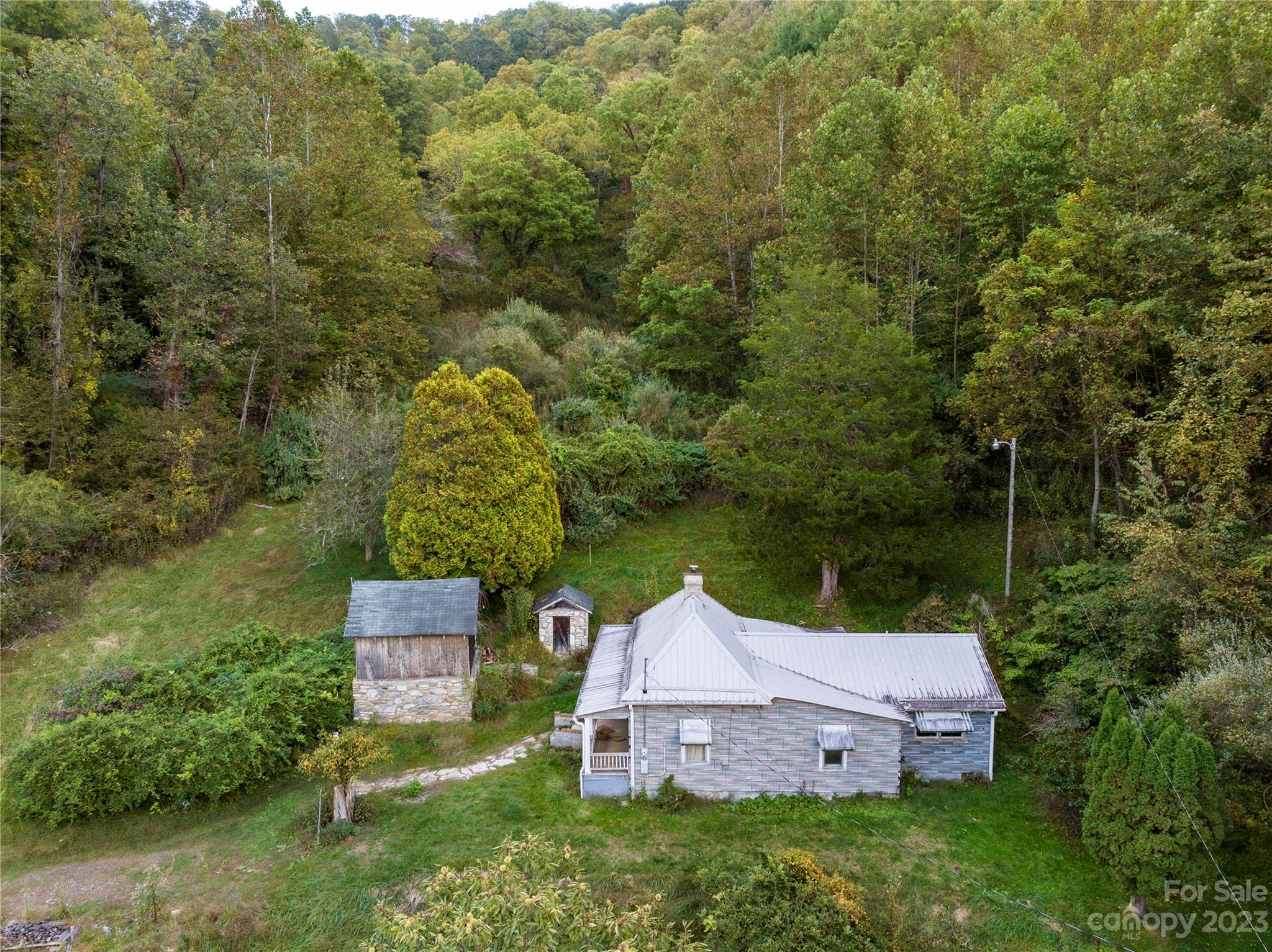 304 Miller Hill Road Burnsville, NC 28714 - Photo 8 of 20 a view of a house with a yard