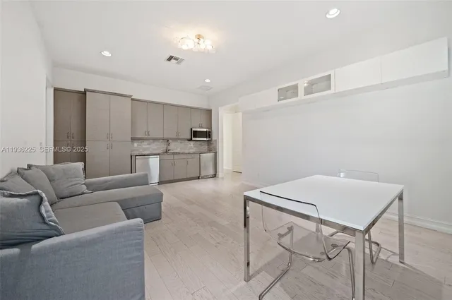 a living room with a couch and a stove top oven