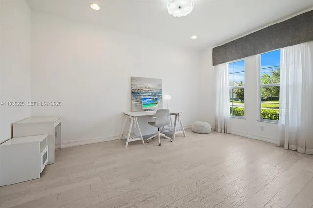 a view of a livingroom with furniture and a window