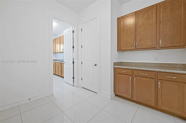 a view of a kitchen with cabinets