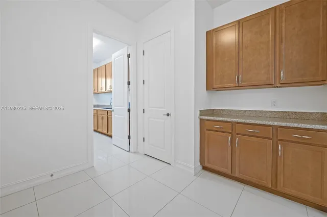 a view of a kitchen with cabinets