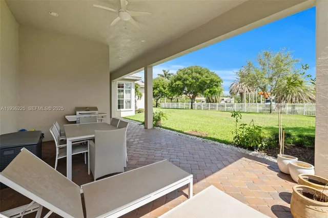 a view of a patio with a yard