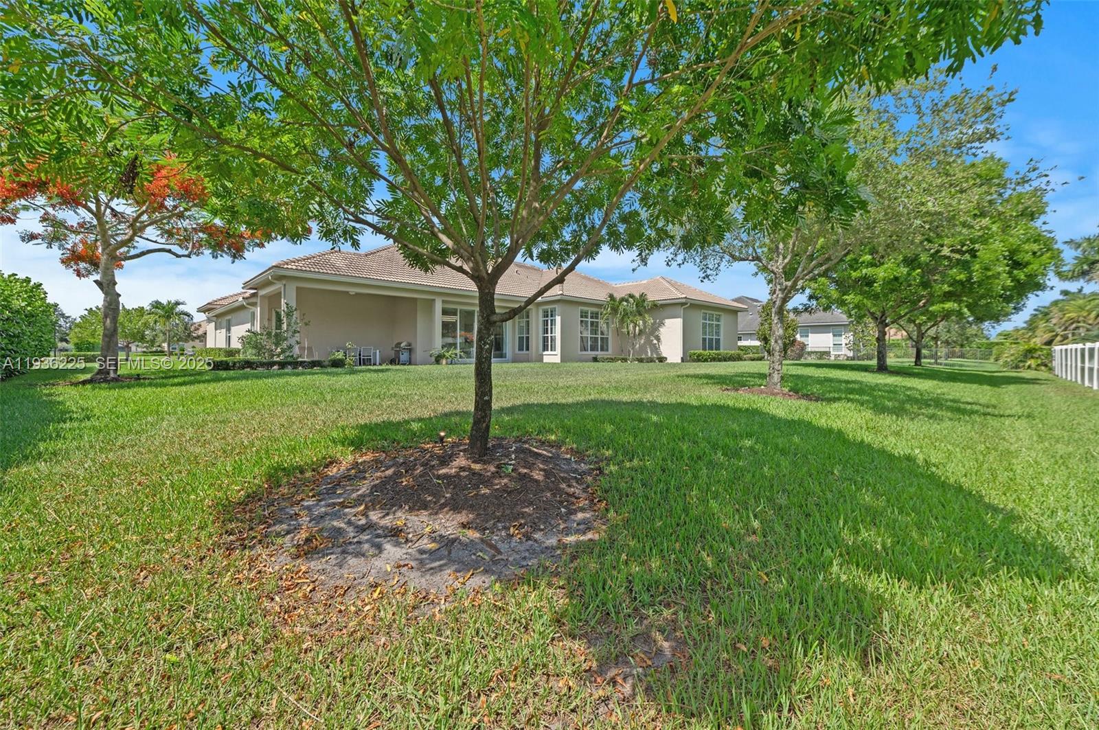 5292 South Sterling Ranch Circle Davie, FL 33314 - Photo 39 of 39 a front view of a house with a garden