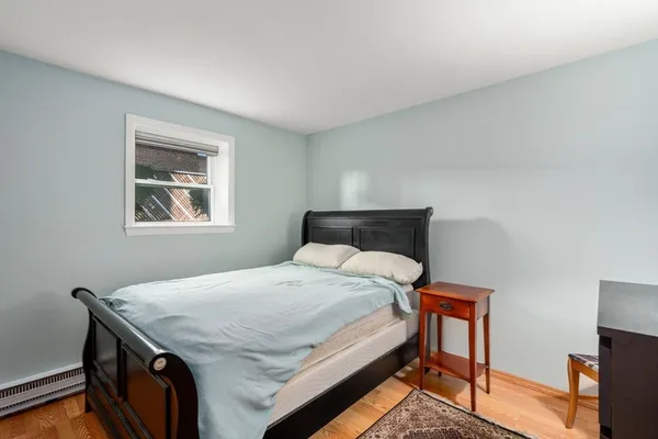a bedroom with a bed and a desk
