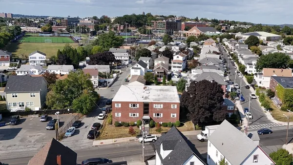 an aerial view of a house with outdoor space