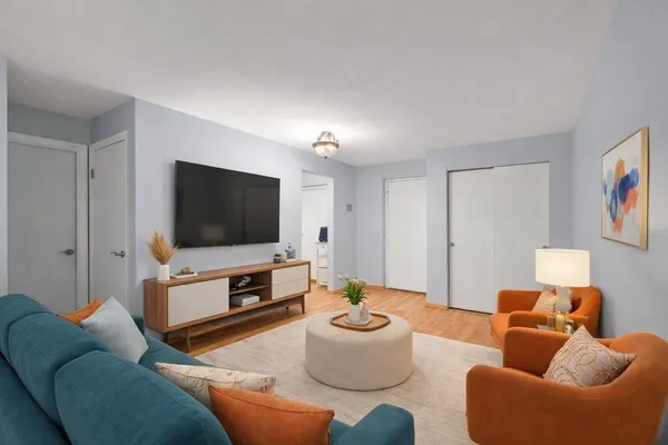 a living room with furniture and a flat screen tv
