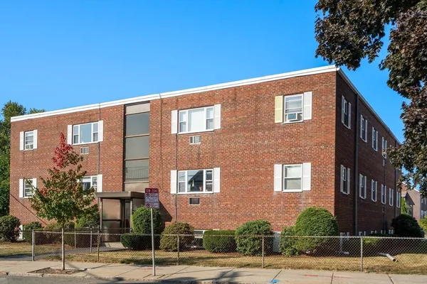 a front view of a building with street view
