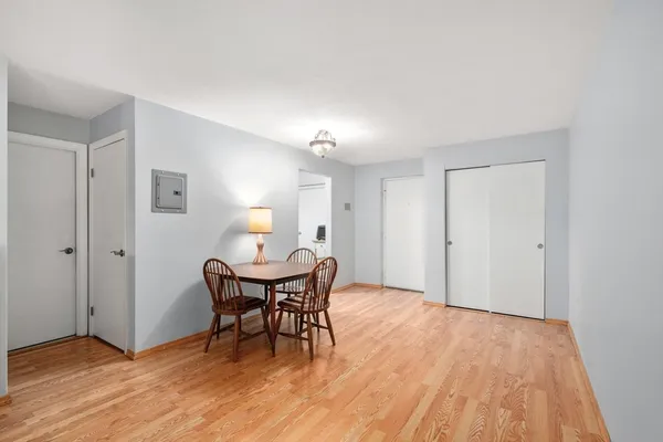 a view of a dining room with furniture and wooden floor