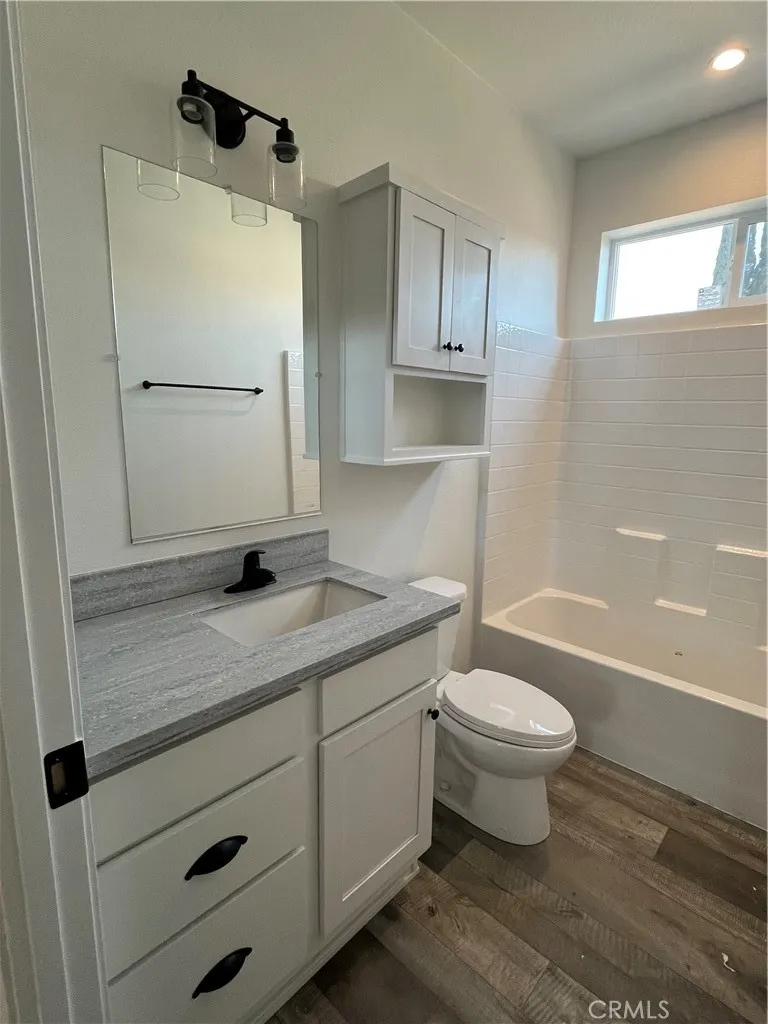 1550 Rimpau, Unit 42 Corona, CA 92881 - Photo 10 of 22 a bathroom with a sink toilet and shower