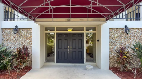 a view of a wooden door of the house