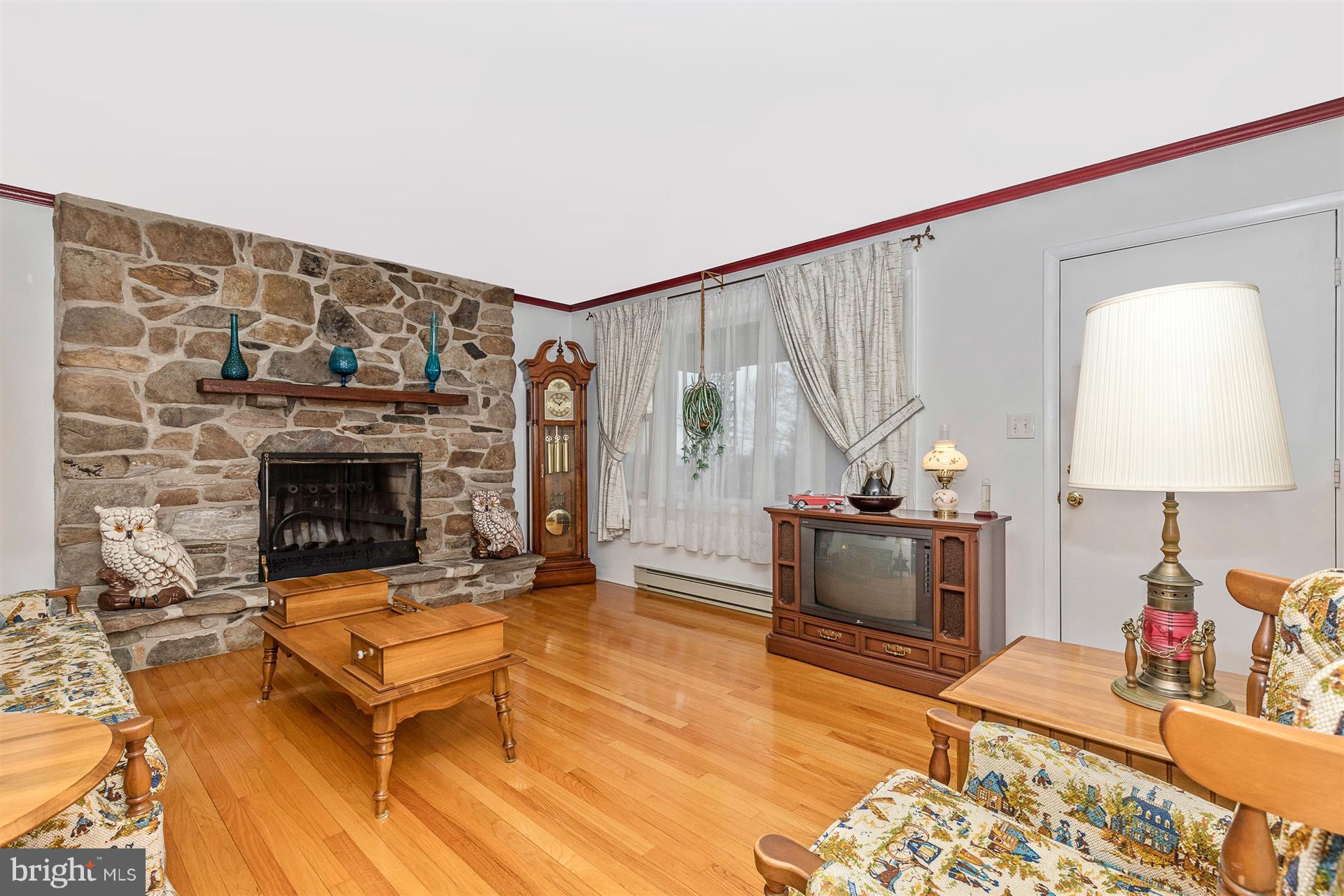 4406 Teen Barnes Road Frederick, MD 21703 - Photo 11 of 30 a living room with furniture and a fireplace