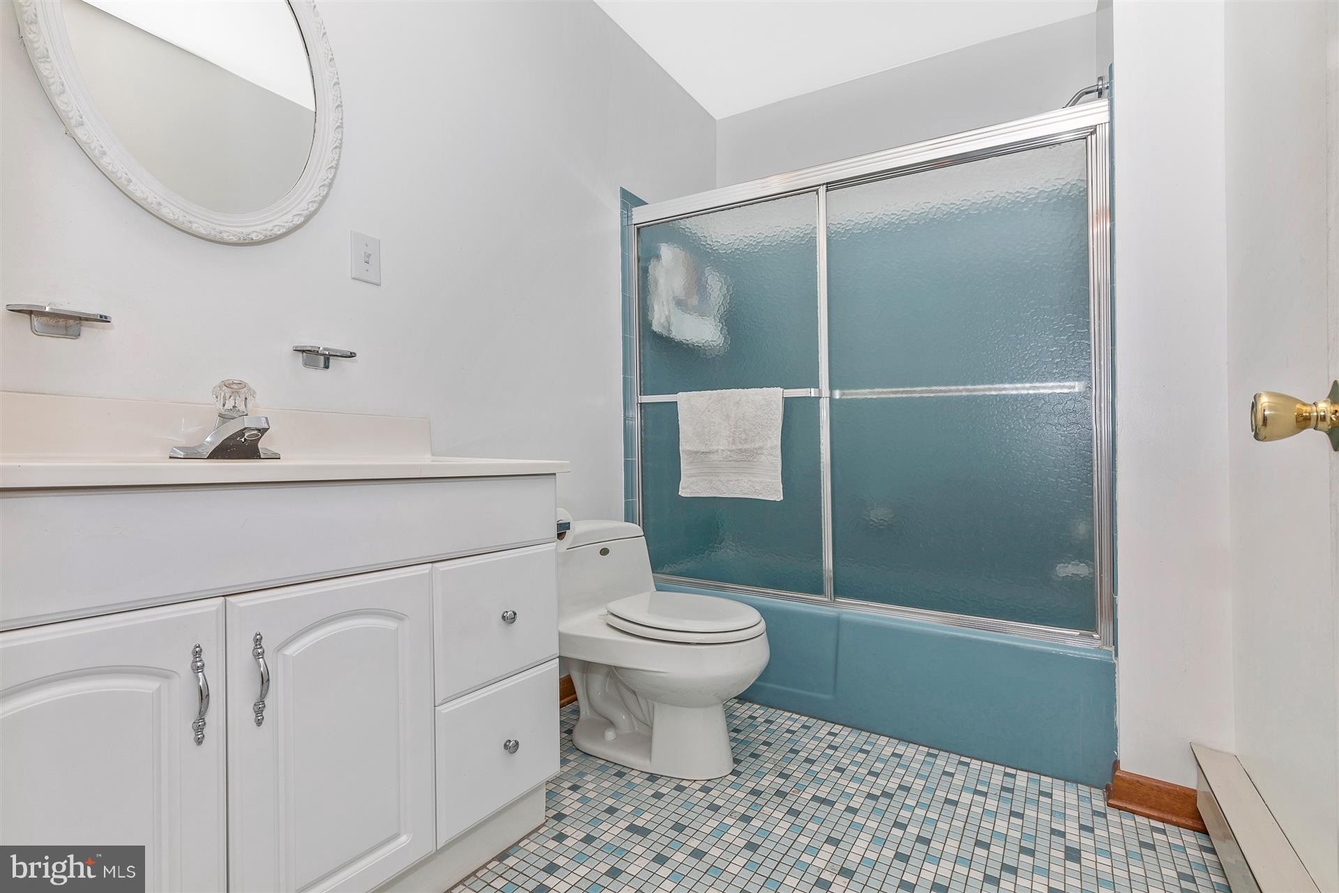4406 Teen Barnes Road Frederick, MD 21703 - Photo 20 of 30 a bathroom with a sink a toilet and shower