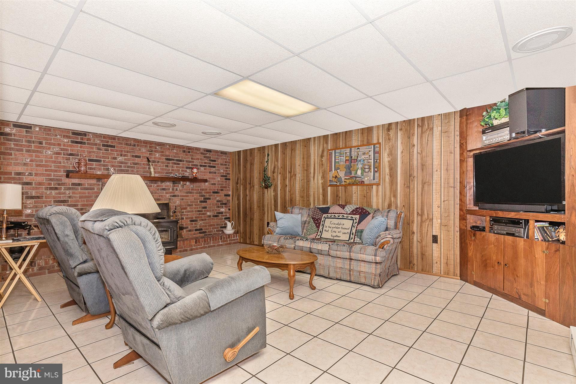 4406 Teen Barnes Road Frederick, MD 21703 - Photo 24 of 30 a living room with furniture and a flat screen tv